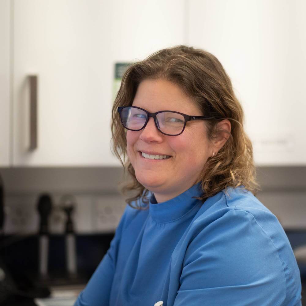 Christa sitting in the consult room